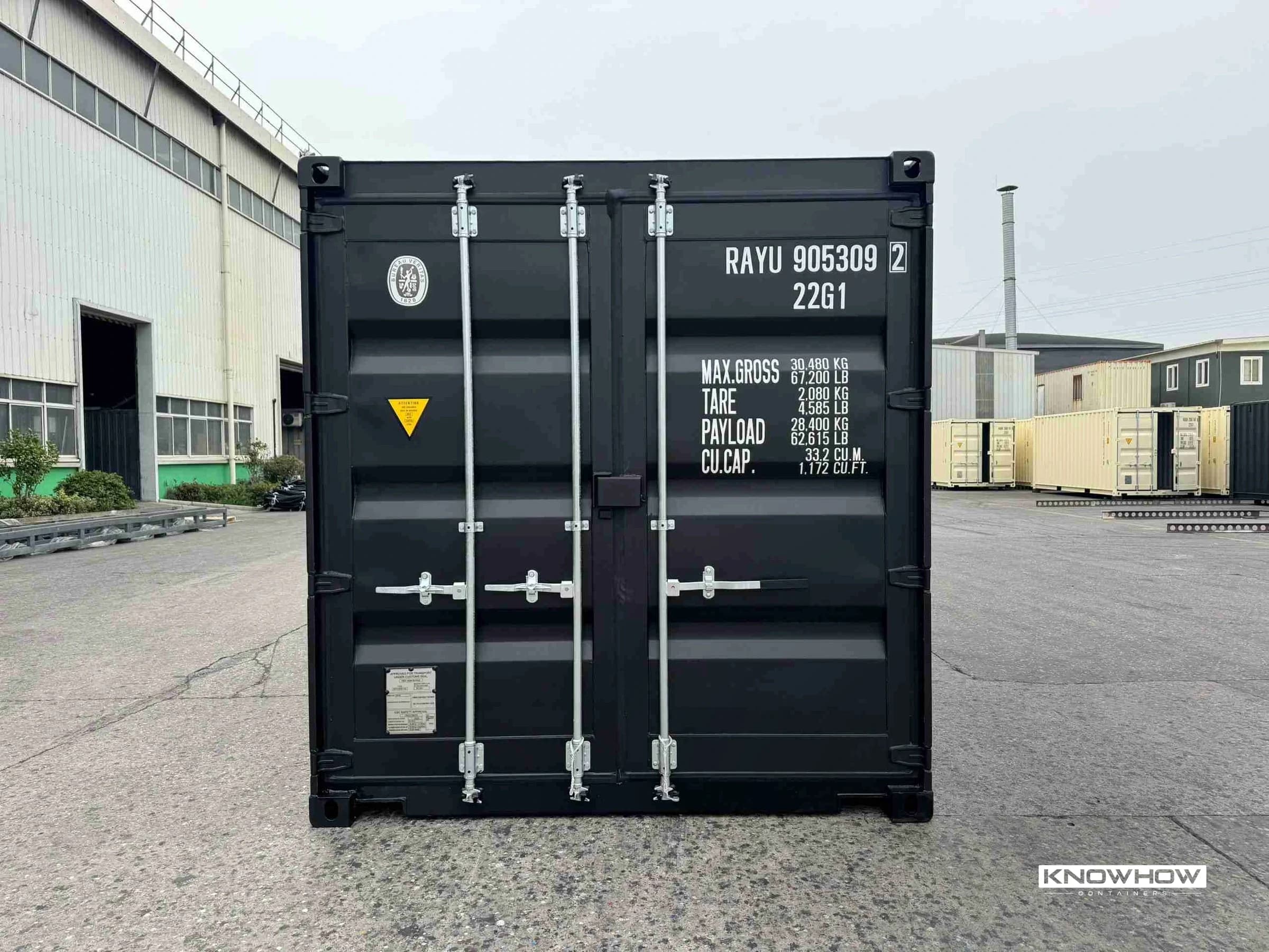 Front view of a 20ft dry van shipping container in RAL 9005 jet black, showing double cargo doors with locking bars, hinges, and handles, with CSC plate and weight markings visible.